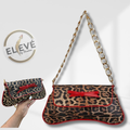 Leopard print handbag with red bow and gold chain strap